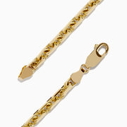 The Mens 14K Yellow Gold Solid Chain Link Bracelet 8.5 features a lobster clasp and is displayed in a circular shape on a plain white background.