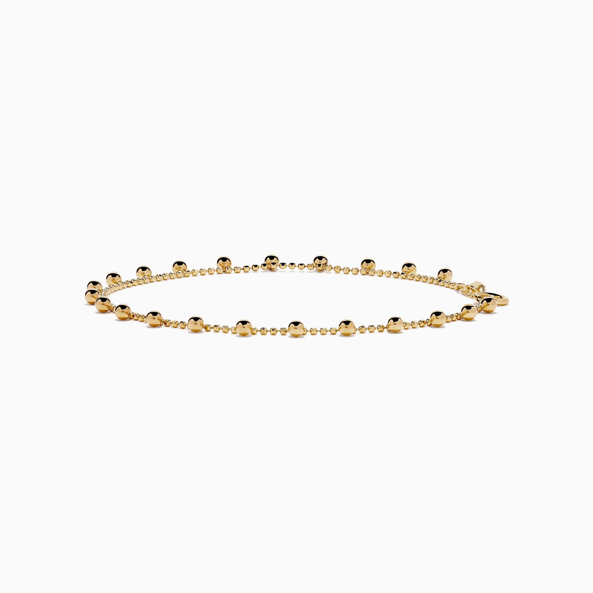The 14K Yellow Gold Tassel Bead Chain Bracelet features small, evenly spaced round charms on a delicate chain, finished with a secure lobster clasp closure.