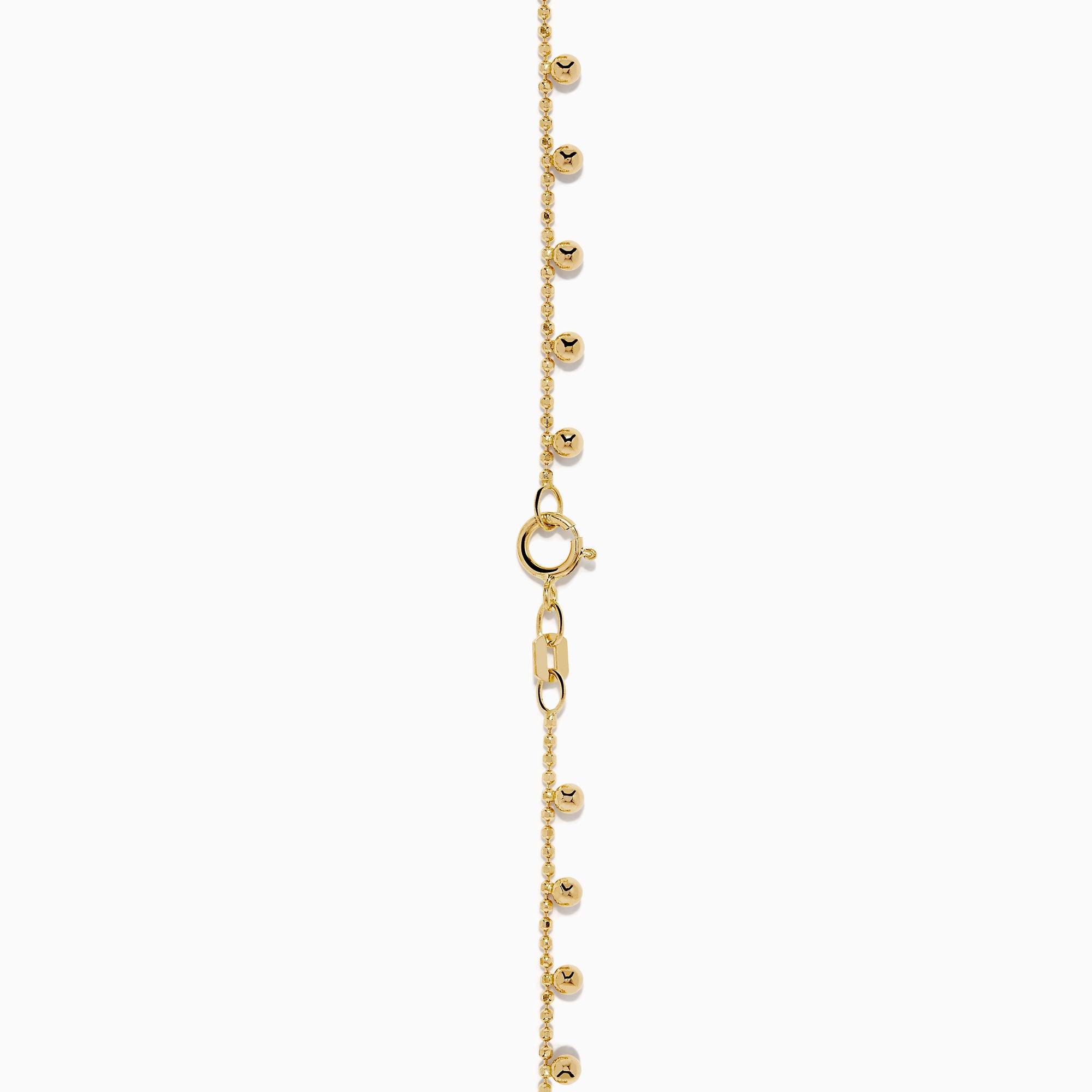 The 14K Yellow Gold Tassel Bead Chain Bracelet features small, evenly spaced round charms on a delicate chain, finished with a secure lobster clasp closure.