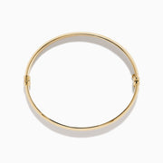 The 14K Yellow Gold Oval with Hinge Bracelet features a polished, smooth surface and classic oval hinge design, displayed against a plain white background.