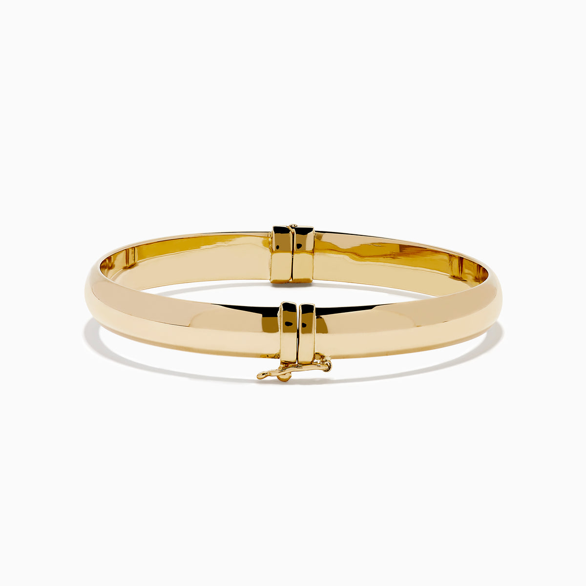 The 14K Yellow Gold Oval with Hinge Bracelet features a polished, smooth surface and classic oval hinge design, displayed against a plain white background.