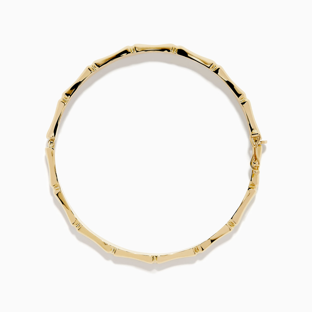 The 14K Yellow Gold Bamboo Hinge Bangle features a polished, bamboo-inspired texture and is photographed on a white background.