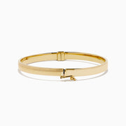 The 14K Yellow Gold Hollow Hinge Bracelet features a polished finish with subtle textured detailing along the edge, shown on a white background.
