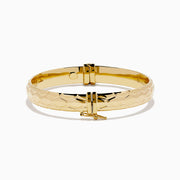 The 14K Yellow Gold Textured Hinge Bracelet features a shiny finish and a geometric diamond-patterned texture around its outer surface, shown on a white background.