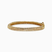 The DOro 14K Yellow Gold Bracelet features three rows of bezel-set diamonds and a secure box clasp, offering a polished and elegant finish.