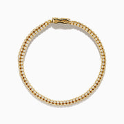 The DOro 14K Yellow Gold Bracelet features three rows of bezel-set diamonds and a secure box clasp, offering a polished and elegant finish.