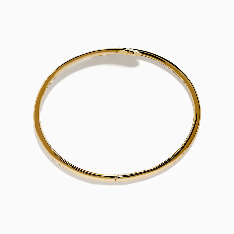 The D'Oro 14k Yellow Gold Diamond Bypass Bangle showcases two overlapping ends tipped with pear-shaped diamonds and a band lined with small round diamonds.