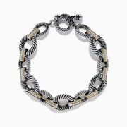 The 925 Sterling Silver Two Tone 18K Yellow Gold Textured Link Diamond Bracelet features twisted, textured links with small gold accents and alternating patterns, displayed against a white background.