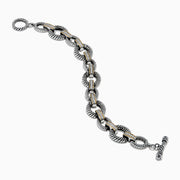 The 925 Sterling Silver Two Tone 18K Yellow Gold Textured Link Diamond Bracelet features twisted, textured links with small gold accents and alternating patterns, displayed against a white background.
