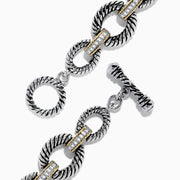 The 925 Sterling Silver Two Tone 18K Yellow Gold Textured Link Diamond Bracelet features twisted, textured links with small gold accents and alternating patterns, displayed against a white background.