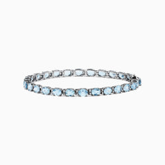The Aquarius 14K White Gold Aquamarine Tennis Bracelet 8.23 TCW showcases a continuous row of round, light blue aquamarines in individual prong settings for timeless elegance.