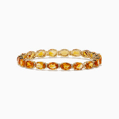 The Sunset 14K Yellow Gold Citrine Tennis Bracelet 19.15 TCW features round, faceted yellow and orange gemstones in an alternating pattern, shown on a white background.