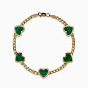 The 14K Yellow Gold Malachite and Diamond 5 Motif Heart Bracelet features five green malachite heart charms, each bordered by diamond-accented stones, evenly spaced along a yellow gold chain with a secure clasp.