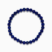 The Men's Lapis Lazuli Beaded Bracelet features polished round blue beads with subtle gold flecks, elegantly displayed on a white background.