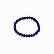 The Men's Lapis Lazuli Beaded Bracelet features polished round blue beads with subtle gold flecks, elegantly displayed on a white background.