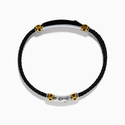Mens 925 Sterling Silver and Leather Onyx Bracelet features black braided leather, gold and sterling silver accent clasps, a black rectangular plate, and a small round emblem on a white background.