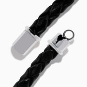 The Mens 925 Sterling Silver Spinel Leather Bracelet features black braided leather, a shiny sterling silver clasp, and a rectangular silver accent with sparkling black spinels, displayed against a white background.