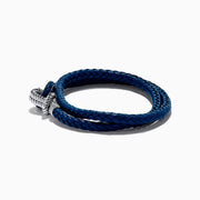 The Mens 925 Sterling Silver Leather Wrap Bracelet showcases a double-wrap blue leather band with a nautical-inspired silver hook and knot clasp, set against a white background. An ideal accessory for effortless mens style.