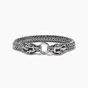 The Mens 925 Silver & 14K Yellow Gold Black Sapphire and Tsavorite Dragon Bracelet features two detailed dragon heads with black sapphire eyes, facing each other and joined by a round clasp.