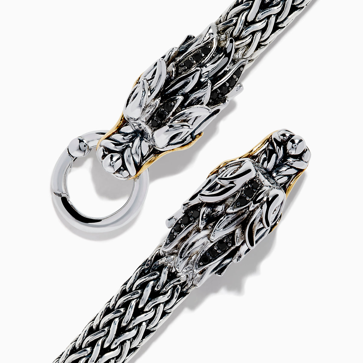The Mens 925 Silver & 14K Yellow Gold Black Sapphire and Tsavorite Dragon Bracelet features two detailed dragon heads with black sapphire eyes, facing each other and joined by a round clasp.