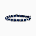 The 925 Sterling Silver Leather Bracelet features dark blue leather threaded through chain links and is displayed on a plain white background.