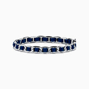 The 925 Sterling Silver Leather Bracelet features dark blue leather threaded through chain links and is displayed on a plain white background.