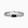 The Mens Sterling Silver Black Spinel Bracelet features a woven chain, a rectangular textured black spinel centerpiece, and a secure clasp closure, shown on a white background.