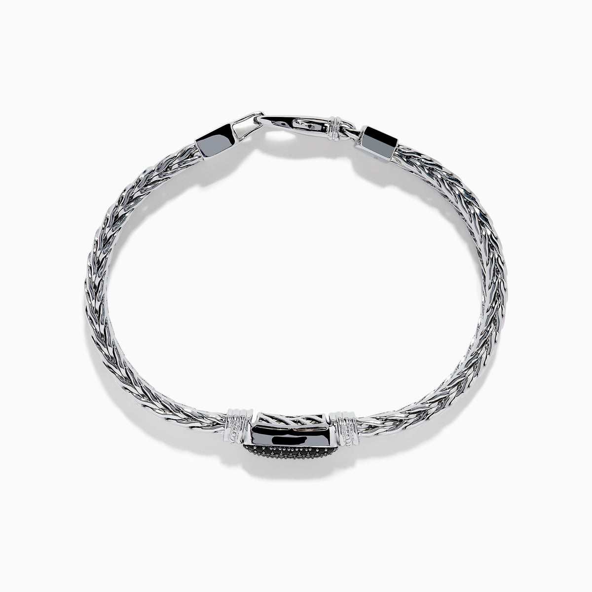 The Mens Sterling Silver Black Spinel Bracelet features a woven chain, a rectangular textured black spinel centerpiece, and a secure clasp closure, shown on a white background.