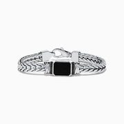 The Mens 925 Sterling Silver Onyx and Black Diamond Bracelet features a woven chain design, a rectangular onyx center stone in a decorative frame, black diamond accents, and a secure lobster clasp closure.