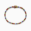 The 925 Sterling Silver 18K Plated Multi Gemstone Bracelet showcases alternating oval-cut blue, green, orange, and red gemstones in a continuous pattern, secured with a clasp.