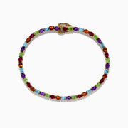 The 925 Sterling Silver 18K Plated Multi Gemstone Bracelet showcases alternating oval-cut blue, green, orange, and red gemstones in a continuous pattern, secured with a clasp.