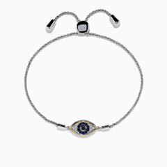 The 925 Sterling Silver Blue Sapphire and Diamond Evil Eye Bracelet features an eye-shaped charm with a blue sapphire center, surrounded by sparkling diamonds, and two metallic ends on the adjustable chain.