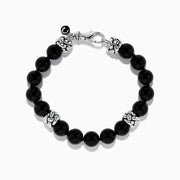 The Mens 925 Sterling Silver Onyx Bracelet features shiny black round beads, three ornate sterling silver spacers, a silver lobster clasp, and a small charm, displayed on a white background.