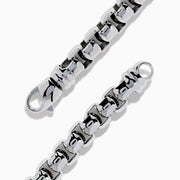 The Mens 925 Sterling Silver London Blue Topaz Bracelet showcases a chunky polished silver chain with a rectangular bar centerpiece adorned with small, round London Blue Topaz gemstones.