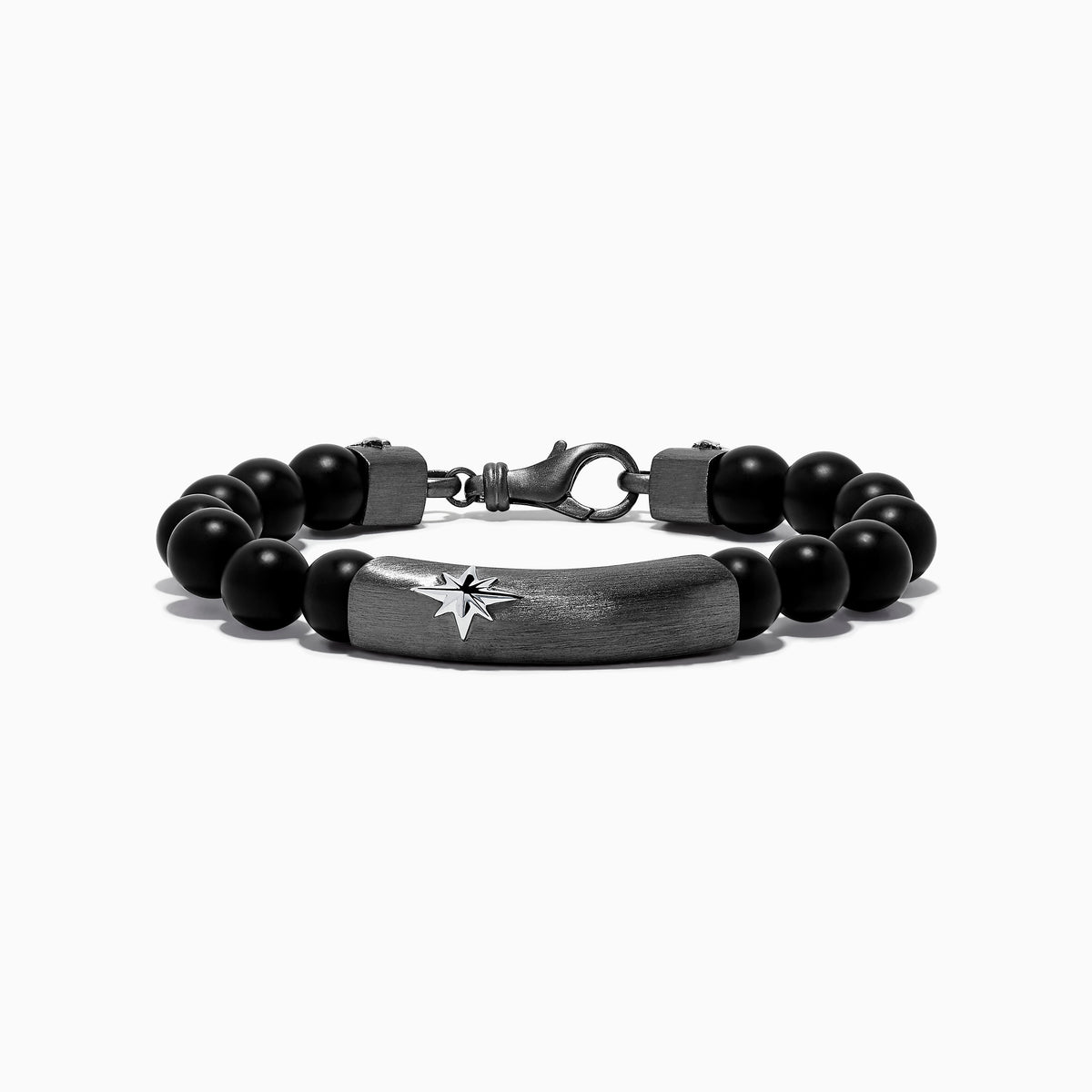 The Mens Sterling Silver Beaded Black Agate Bracelet features round black agate beads, sterling silver accents, a rectangular plate engraved with a starburst, and two cylindrical silver beads with star motifs near the clasp.
