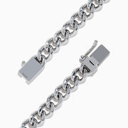 The 925 Sterling Silver Panther Bracelet features thick, shiny links and a rectangular clasp, elegantly arranged in a circular shape on a white background.