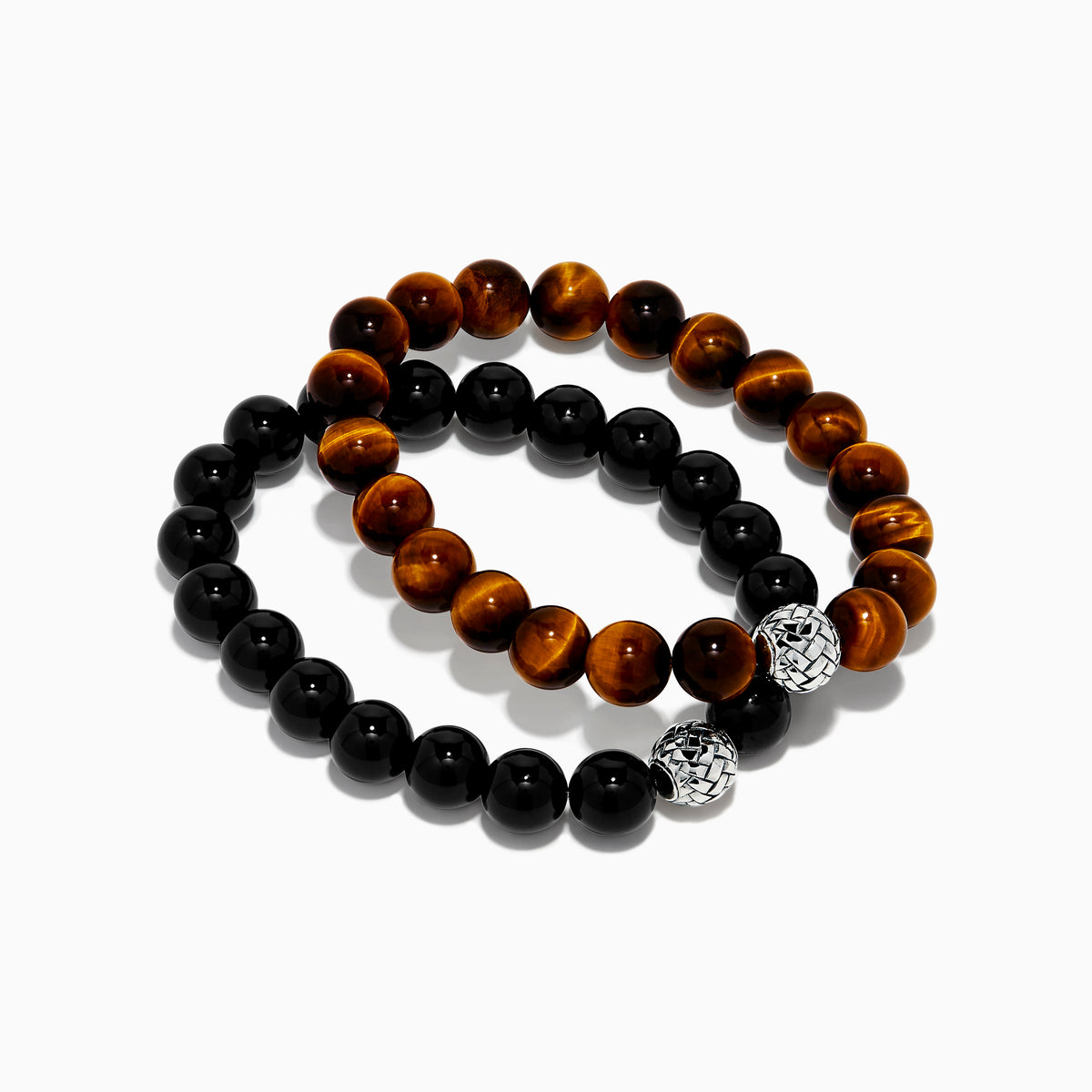 The Tiger's Eye and Onyx Beaded 2-Piece Bracelet Set with Sterling Silver features brown and black beads, each bracelet accented by a single sterling silver bead with a textured, woven pattern for an elegant stacked look.