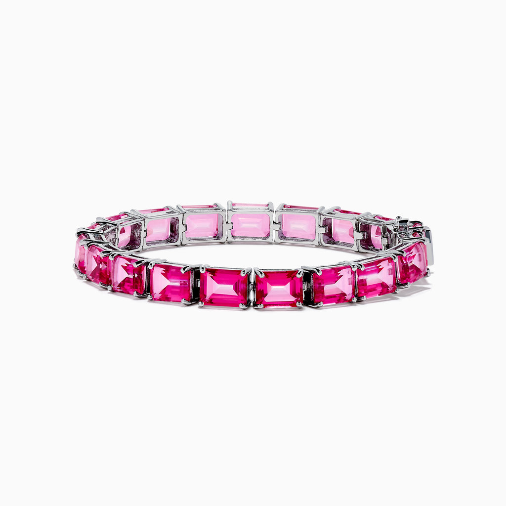 The 925 Sterling Silver Pink Topaz Tennis Bracelet features vibrant rectangular pink topaz gemstones set in individual prongs, forming a continuous elegant line.