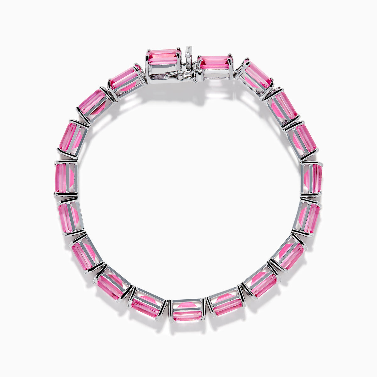The 925 Sterling Silver Pink Topaz Tennis Bracelet features vibrant rectangular pink topaz gemstones set in individual prongs, forming a continuous elegant line.