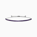 The 925 Sterling Silver Amethyst Bolo Bracelet showcases a single row of small, round amethyst gems set along the band, displayed on a plain white background.