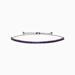The 925 Sterling Silver Amethyst Bolo Bracelet showcases a single row of small, round amethyst gems set along the band, displayed on a plain white background.