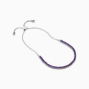 The 925 Sterling Silver Amethyst Bolo Bracelet showcases a single row of small, round amethyst gems set along the band, displayed on a plain white background.