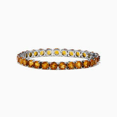 The 925 Sterling Silver Citrine Bracelet showcases a single row of round, faceted amber-orange citrine stones in prong settings against a white background.