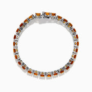The 925 Sterling Silver Citrine Bracelet showcases a single row of round, faceted amber-orange citrine stones in prong settings against a white background.