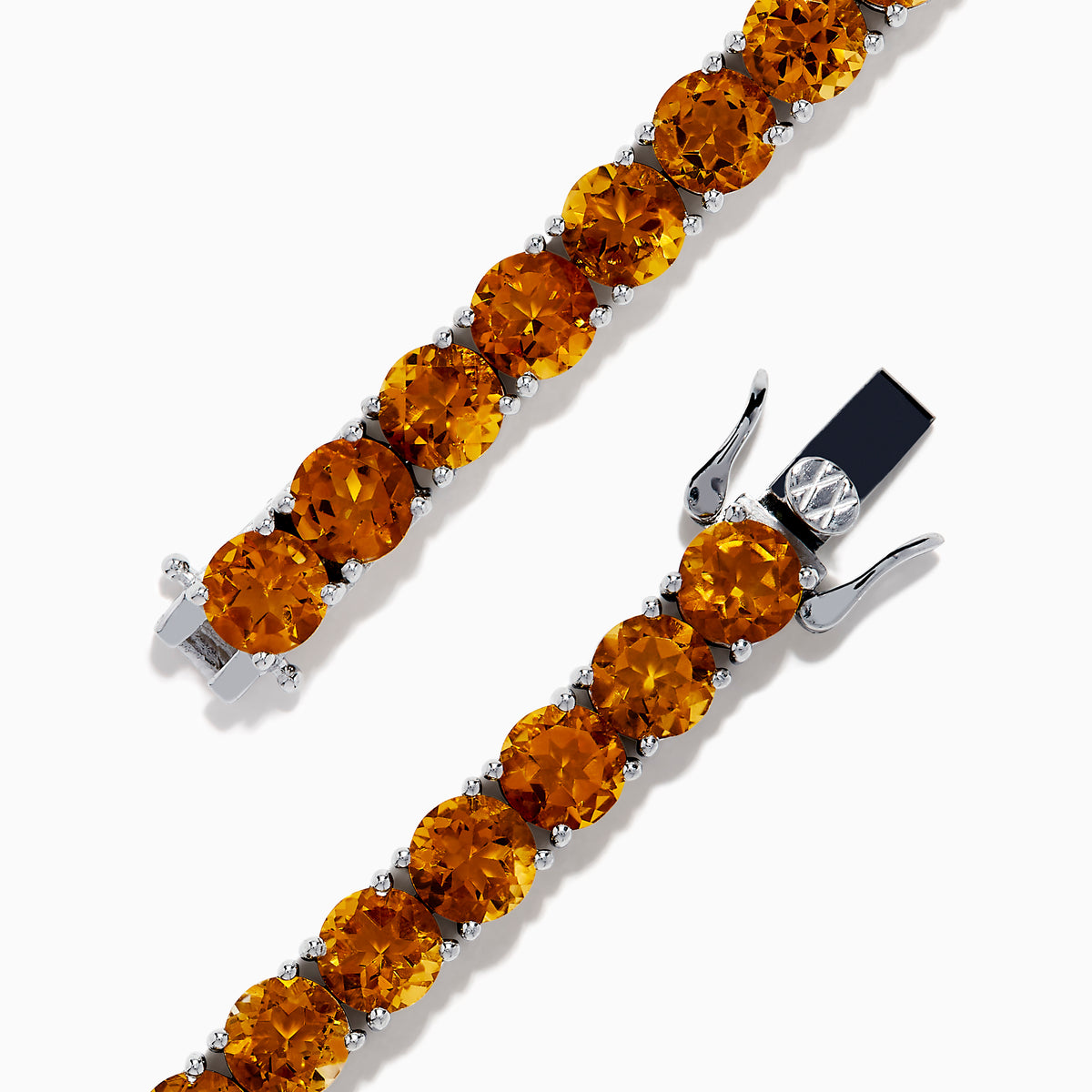 The 925 Sterling Silver Citrine Bracelet showcases a single row of round, faceted amber-orange citrine stones in prong settings against a white background.