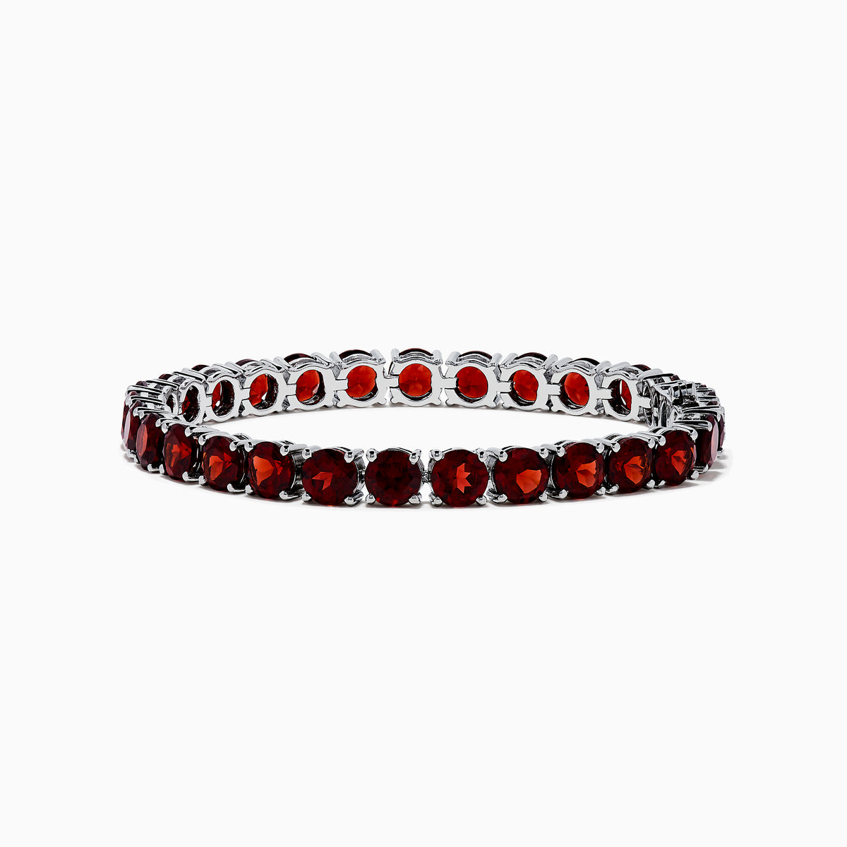 The 925 Sterling Silver Garnet Bracelet features round, deep red garnets set in individual prongs along a sleek tennis chain, beautifully arranged in a circular shape on a white background.