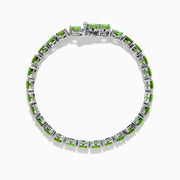 The 925 Sterling Silver Peridot Bracelet showcases a row of oval, bright green gemstones set against a white background for a striking look.