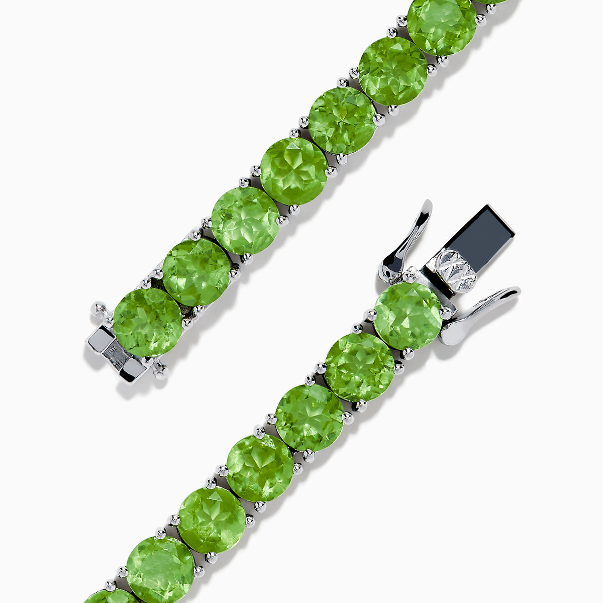 The 925 Sterling Silver Peridot Bracelet showcases a row of oval, bright green gemstones set against a white background for a striking look.
