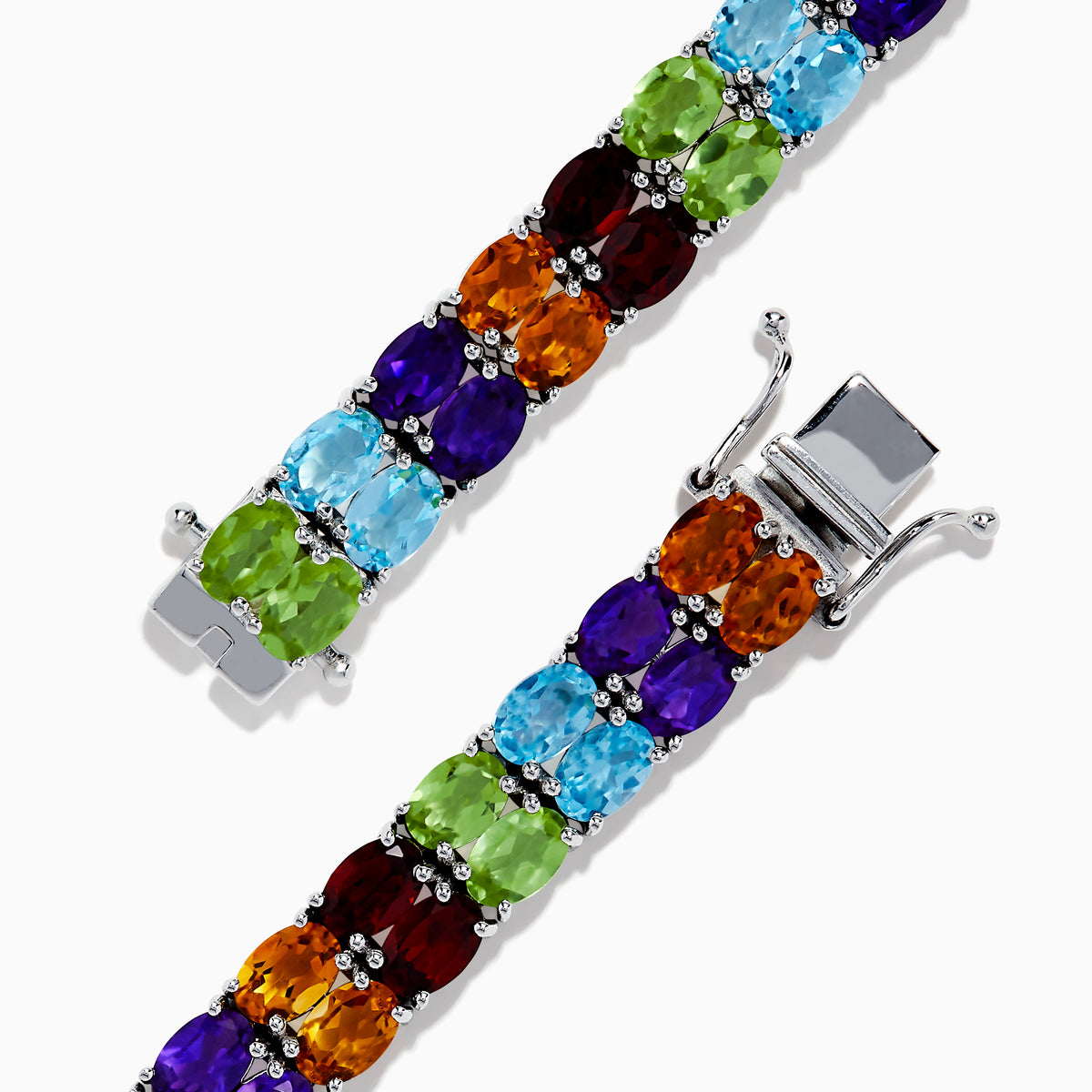The 925 Mosaic Sterling Silver Double Row Multi Gemstone Tennis Bracelet features vibrant green, blue, purple, red, and orange stones in a dazzling repeating pattern.