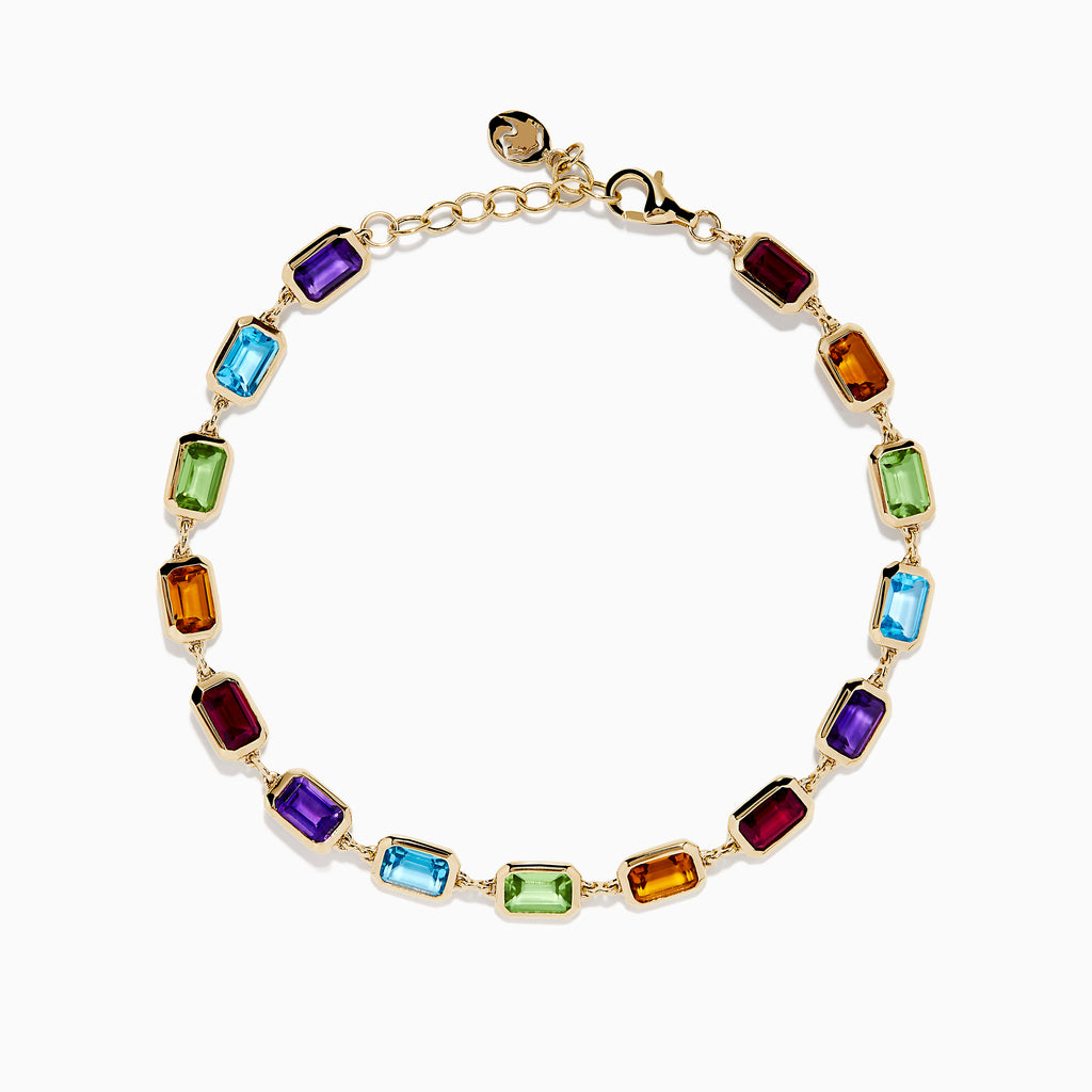 The Mosaic 14K Yellow Gold Bezel Multi Color Gemstone Bracelet showcases blue, green, purple, red, and amber rectangular stones evenly spaced along a delicate chain with an adjustable clasp.